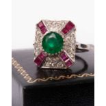 An 18ct white gold, emerald, ruby and diamond ring
