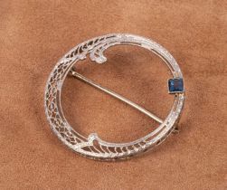 An Art Deco style 14k white gold and sapphire circular brooch