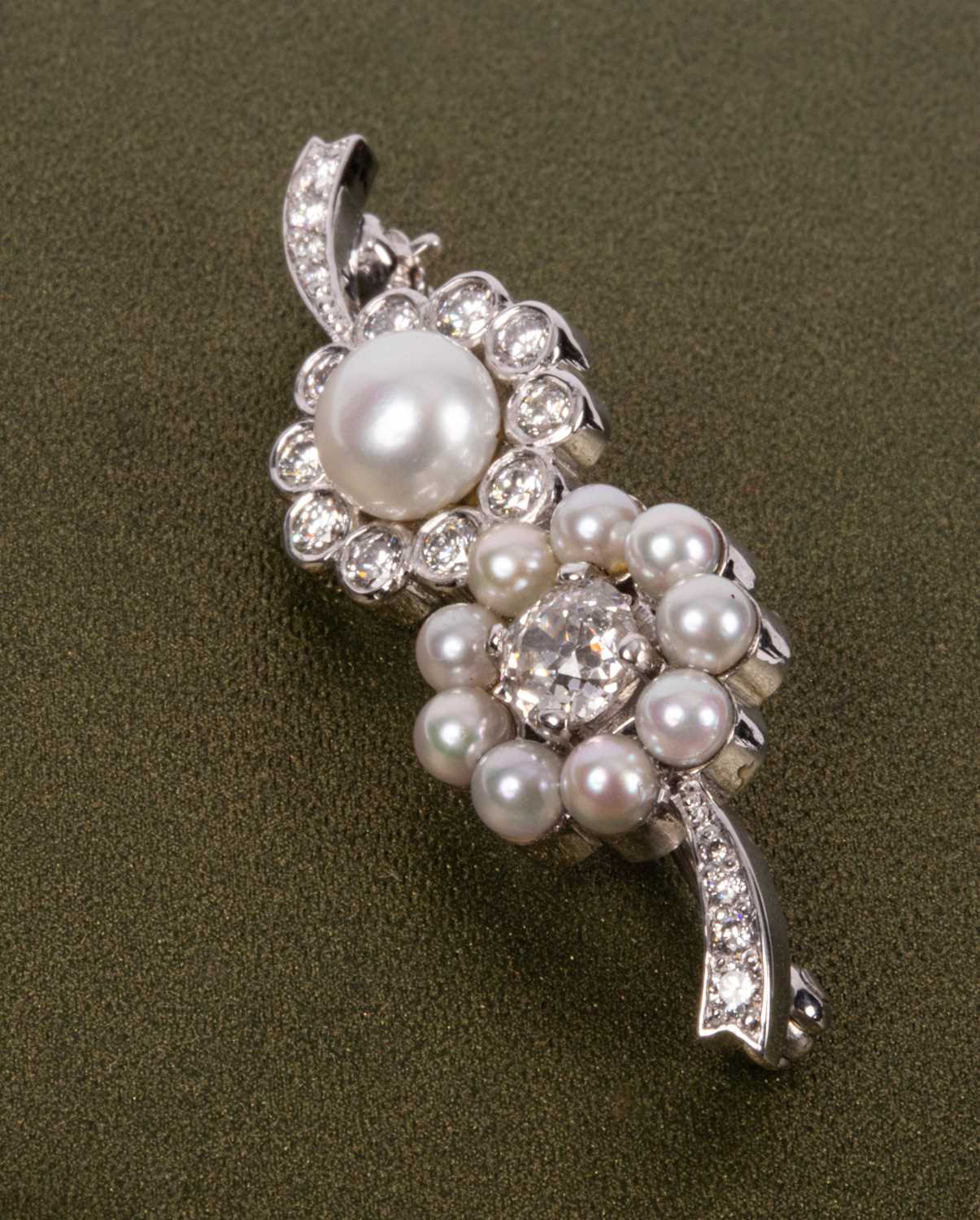 An 18ct white gold diamond and pearl brooch