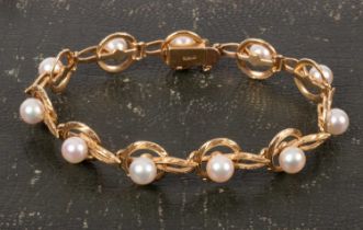 A 14k yellow gold and pearl bracelet