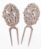 A pair of sterling silver sweetcorn eaters