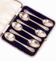 A set of six silver teaspoons, of golfing interest