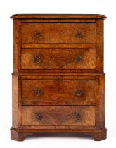 A miniature walnut chest on chest