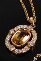 An 18ct gold, diamond and yellow sapphire pendant