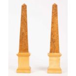 David Linley (born 1961) a pair of sycamore and walnut obelisk table ornaments