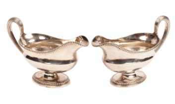 A pair of George III silver sauce boats