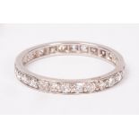 A diamond eternity ring, set in white precious metal, size N approximately 2.