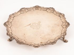 A George III silver salver, EC, London 1763, with shaped scalloped edge and central armorial,