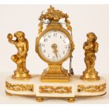 A gilt metal mounted mantel clock, the white enamel dial with Arabic numerals,
