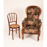 A Victorian mahogany upholstered nursing chair, floral button back upholstery,