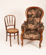 A Victorian mahogany upholstered nursing chair, floral button back upholstery,