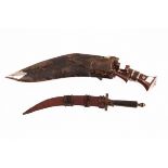 A Kukri type knife, with wooden handle and steel blade,