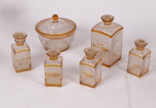 An amber stained engraved glass dressing table set, late 19th Century, Bohemian,