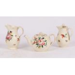 An English creamware globular teapot and cover, hot water jug and cover and milk jug,