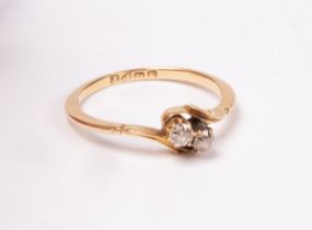 A diamond crossover ring, set in 18ct gold, Chester 1918, each circular diamond 2mm in diameter,