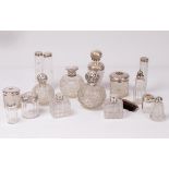 A large quantity of silver mounted glass scent bottles and jars CONDITION REPORT: