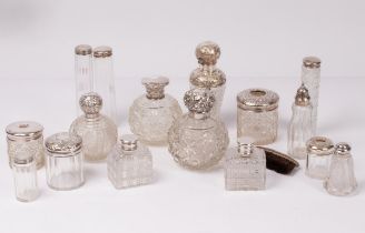 A large quantity of silver mounted glass scent bottles and jars CONDITION REPORT: