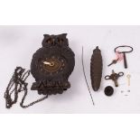 A black forest Paico clock in the form of an owl with amber moving eyes,