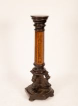 An Edwardian torchère with ebonised circular top on a hexagonal walnut and marquetry column the