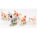 A collection of six Staffordshire cow creamers,