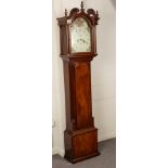 An eight-day mahogany long cased clock, the 12 inch painted arched dial with Roman numerals,