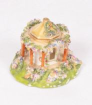 A Coalbrookdale porcelain flower-encrusted pastille burner in the form of an octagonal pavilion,