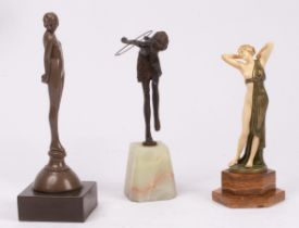 Three Art Deco female figures, one bronze dancer holding hoop on a green onyx base and two others,