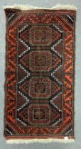 A Bokhara rug, Afghanistan, the maroon field with four octagonal Turkmen type medallions,