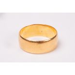 A 22ct gold wedding band, size O/P, approximately 6.