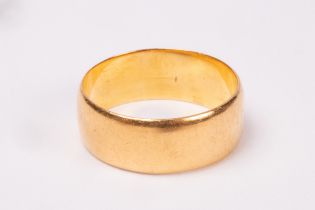 A 22ct gold wedding band, size O/P, approximately 6.