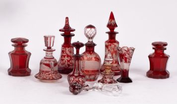A ruby glass scent bottle and stopper, etched throughout with vine leaves, 20cm high,