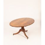 A mahogany oval breakfast table of Regency design,