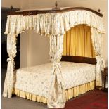An 18th Century style four-poster bed,