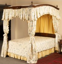 An 18th Century style four-poster bed,