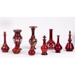 A quantity of ruby glass vases and scent bottles,