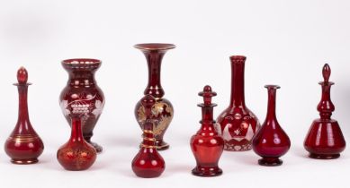 A quantity of ruby glass vases and scent bottles,