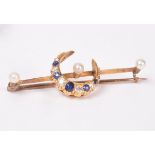 A gold knife-edge bar brooch set three cultured pearls,