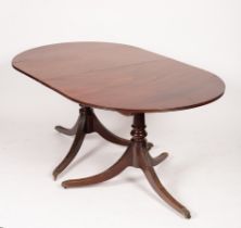A mahogany twin-pedestal dining table,