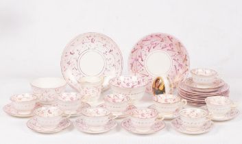 A part pink lustre tea set, comprising: ten cups, ten saucers, nine side plates,