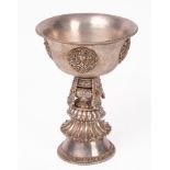 A Tibetan white metal butter lamp,