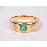 An emerald and diamond dress ring set in 18ct gold,