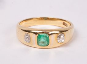 An emerald and diamond dress ring set in 18ct gold,