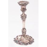 A Victorian silver candlestick, Benjamin Smith, 1867, initialled, chased with vines, weighted,