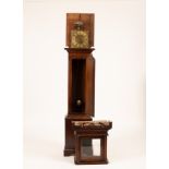 A Quaker thirty-hour oak longcase clock, the 9 inch square dial with single hand and Roman numerals,