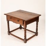 An oak side table, late 17th Century, single drawer on turned supports united by square stretchers,