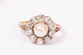 A pearl and diamond cluster ring, the central pearl to a halo of ten diamonds,