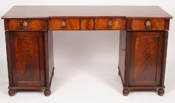 A mahogany sideboard fitted drawers and cupboards,