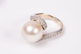 A pearl and diamond ring,