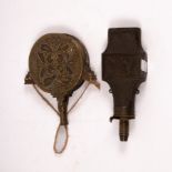 A 19th Century copper powder flask with diaper decoration and embossed central scene of a huntsman