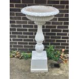 A cast iron bird bath on a baluster column CONDITION REPORT: Condition information